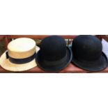 A collection of three vintage hats including 2 black bowler hats; Unbranded and HB Coventry St