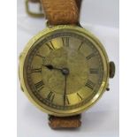 18ct YELLOW GOLD CASED WRIST WATCH, converted from fob watch, in untested condition