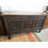 ANTIQUE OAK COFFER, triple panel oak coffer with carved stylised foliate and lunette decoration, 52"