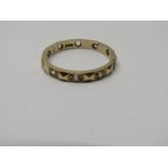 9CT YELLOW GOLD STONE SET ETERNITY STYLE RING, approximately 1.5 grms in weight, size K/L