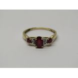 9CT YELLOW GOLD RUBY & DIAMOND RING, principal oval cut ruby set with accent diamonds & 2 further