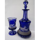 ANTIQUE CONTINENTAL GLASSWARE a Bohemian cased glass decanter and matching beaker decorated with a