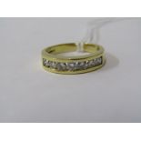 18ct YELLOW GOLD 7 STONE DIAMOND ETERNITY STYLE RING, 7 bright channel set diamonds of good colour