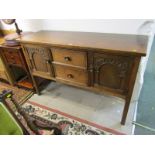 REPRODUCTION OAK SIDEBOARD, double cupboard and twin drawer sideboard carved with arch details and