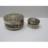 2 SILVER POTS OF HEAVILY EMBOSSED FLORAL DESIGN, both a little rubbed, combined weight of 82.4 grms