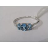 9ct WHITE GOLD 3 STONE TOPAZ RING, 3 graduated size oval cut topaz stones with small accent