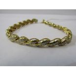 18ct YELLOW GOLD DIAMOND BRACELET, unusual channel set design, bright well matched diamonds