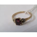 GARNET RING, 10ct yellow gold ring, central garnet with diamonds to each shoulder, size J/K