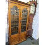 ART NOUVEAU, oak glazed bookcase, twin leaded glass, doors above, double cupboard base with carved