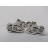 A PAIR OF WHITE GOLD DIAMOND EARRINGS, Each earring containing 2 brilliant cut diamonds giving a