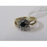 9ct YELLOW GOLD SAPPHIRE & DIAMOND RING, principal sapphire surrounded by illusion set diamonds size