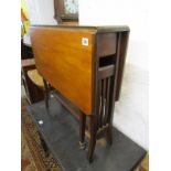 SUTHERLAND TABLE, mahogany drop leaf table with original castors, 27" length