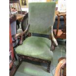 CAROLEAN DESIGN ARMCHAIR, green upholstered highback armchair with pierced and carved seat frieze