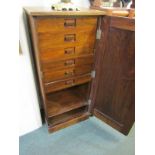 SPECIMEN CABINET, pedestal narrow single door enclosing 6 graduated drawers and open base, 43"