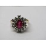 18CT YELLOW GOLD RUBY & DIAMOND CLUSTER RING, principal oval cut ruby measuring approximately 1ct