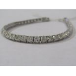 SPECTACULAR 18ct WHITE GOLD DIAMOND LINE BRACELET, 44 brilliant cut diamonds totalling approximately