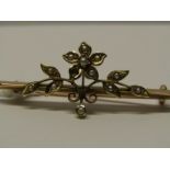 9CT YELLOW GOLD FLORAL BROOCH, set with seed pearls (1 missing) approximately 2.5 grms in weight