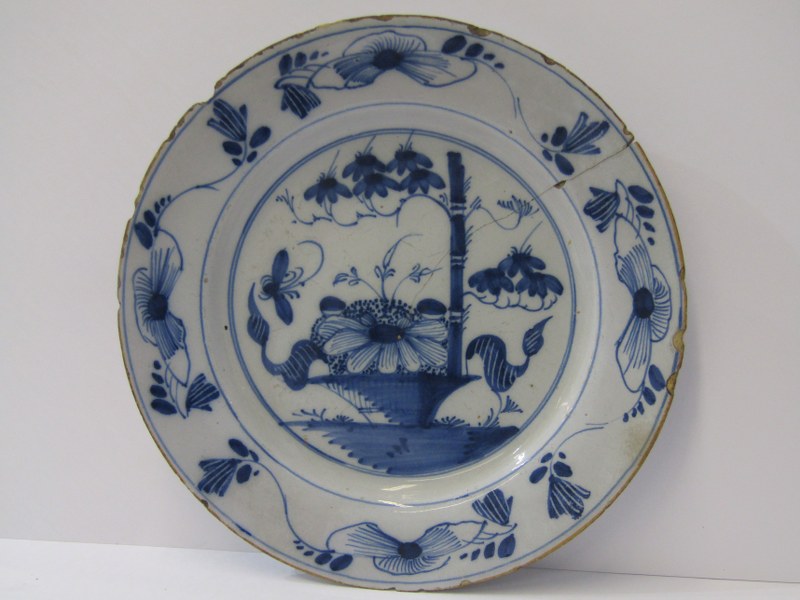 EARLY DELFT, "Butterfly & Vase" pattern 9" blue painted dessert plate (rim chips and hairline crack)