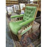EDWARDIAN GREEN BUTTON BACK OPEN ARMCHAIR, spindle arm supports