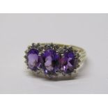 9CT YELLOW GOLD AMETHYST & DIAMOND CLUSTER RING, 3 principal oval cut amethysts surrounded by a