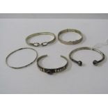 SILVER BANGLES, 5 assorted silver bangles, including hinged bangle with foliate decoration, slave