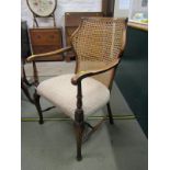 EDWARDIAN CANE BACK BEDROOM ARMCHAIR, cabriole legs and H stretcher