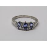 9CT WHITE GOLD TANZANITE & DIAMOND RING, 3 principal marquise cut tanzanites each separated by a