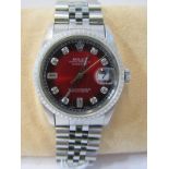 ROLEX WRIST WATCH, a Gentleman's Rolex Oyster wrist watch, with date aperture, unusual red starburst