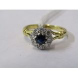 18CT YELLOW GOLD SAPPHIRE & DIAMOND CLUSTER RING, principal dark blue sapphire surrounded by 8