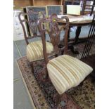 VICTORIAN SALON CHAIRS, pair of ornate pierced and carved back salon chairs with original castors