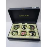 MOORCROFT, boxed set of 6 floral design egg cups, stamped "Trial"
