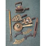 METALWARE, antique box iron, 3 ornamental brass trivets, brass chamber stick, toasting fork and