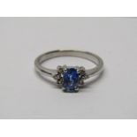 18CT WHITE GOLD SAPPHIRE & DIAMOND CLUSTER RING, principal oval cut sapphire of good colour, set