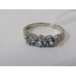 9ct WHITE GOLD TOPAZ & DIAMOND RING, 3 principal well matched blue topaz stones with accent diamonds