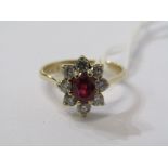 18ct YELLOW GOLD RUBY & DIAMOND CLUSTER RING, principal oval cut ruby surrounded by brilliant cut
