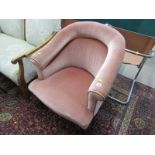 EDWARDIAN TUB ARMCHAIR, upholstered in pink draylon with tapering turned legs and original castors