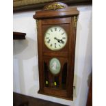 WALL CLOCK, a quality oak framed wall clock with enamelled dial & Roman numerals, the case with