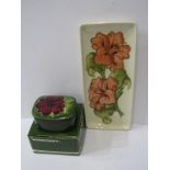 MOORCROFT, "Hibiscus" pattern rectangular pen tray and similar "Anemone" pattern green ground lidded