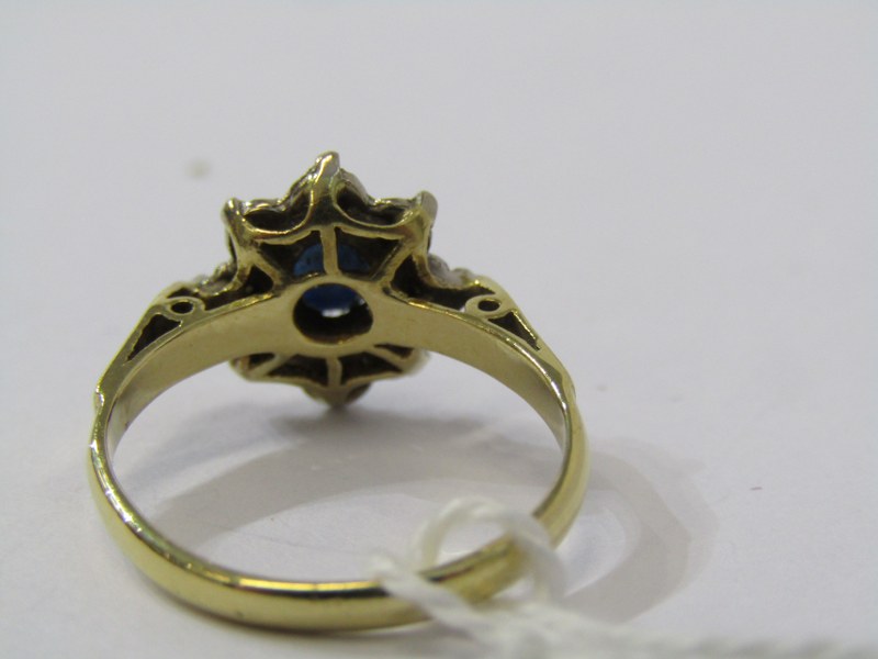 18CT YELLOW GOLD SAPPHIRE & DIAMOND CLUSTER RING, principal oval cut dark blue sapphire surrounded - Image 3 of 3