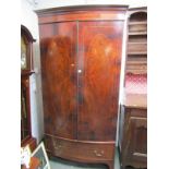 HEPPLEWHITE DESIGN BOWFRONTED TWIN DOOR WARDROBE, oval inlaid flambe mahogany doors with single