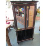 FINE COROMANDEL & IVORY INLAID TWIN MIRRORED DOOR NARROW MUSIC CABINET with open rack base, by Lambs