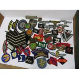 MILITARY, A collection of embroidered cloth military badges including several with Nazi emblems