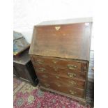 PROVINCIAL GEORGIAN NARROW BUREAU, shaped brass escutcheons, with bracket feet and simple fitted