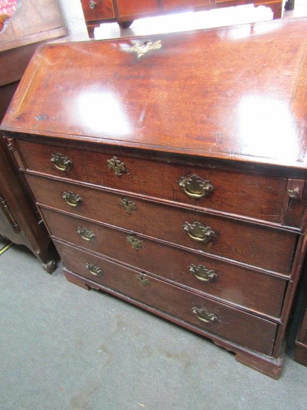 PROVINCIAL GEORGIAN OAK BUREAU, 4 graduated long drawers with period swan neck handle and crude