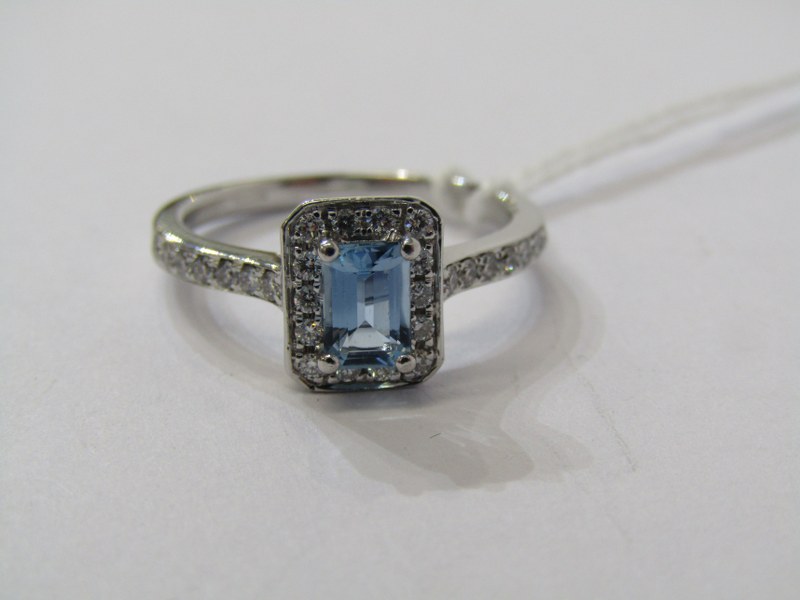 18CT WHITE GOLD AQUAMARINE & DIAMOND CLUSTER RING, principal rectangular cut aquamarine of good