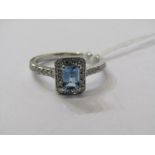 18CT WHITE GOLD AQUAMARINE & DIAMOND CLUSTER RING, principal rectangular cut aquamarine of good