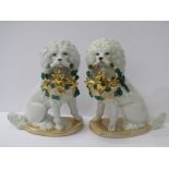 PORCELAIN DOGS, pair of 19th Century seated dogs carrying baskets of gilded pigs, 8" height