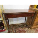 19th CENTURY MAHOGANY TEA TABLE, fold top with inlaid frieze on tapering turned legs, 36" width