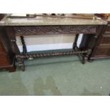 FLEMISH CARVED OAK SIDE TABLE, "Fossil" marble top with barley twist stretcher legs and vine leaf