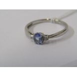 9ct WHITE GOLD TANZANITE & DIAMOND RING, principal oval cut pale tanzanite with accent cut